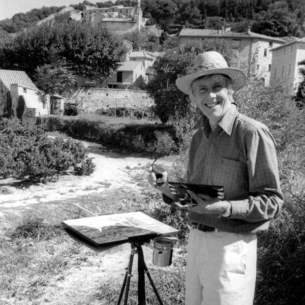 Ted Dyer stood next to some of his work