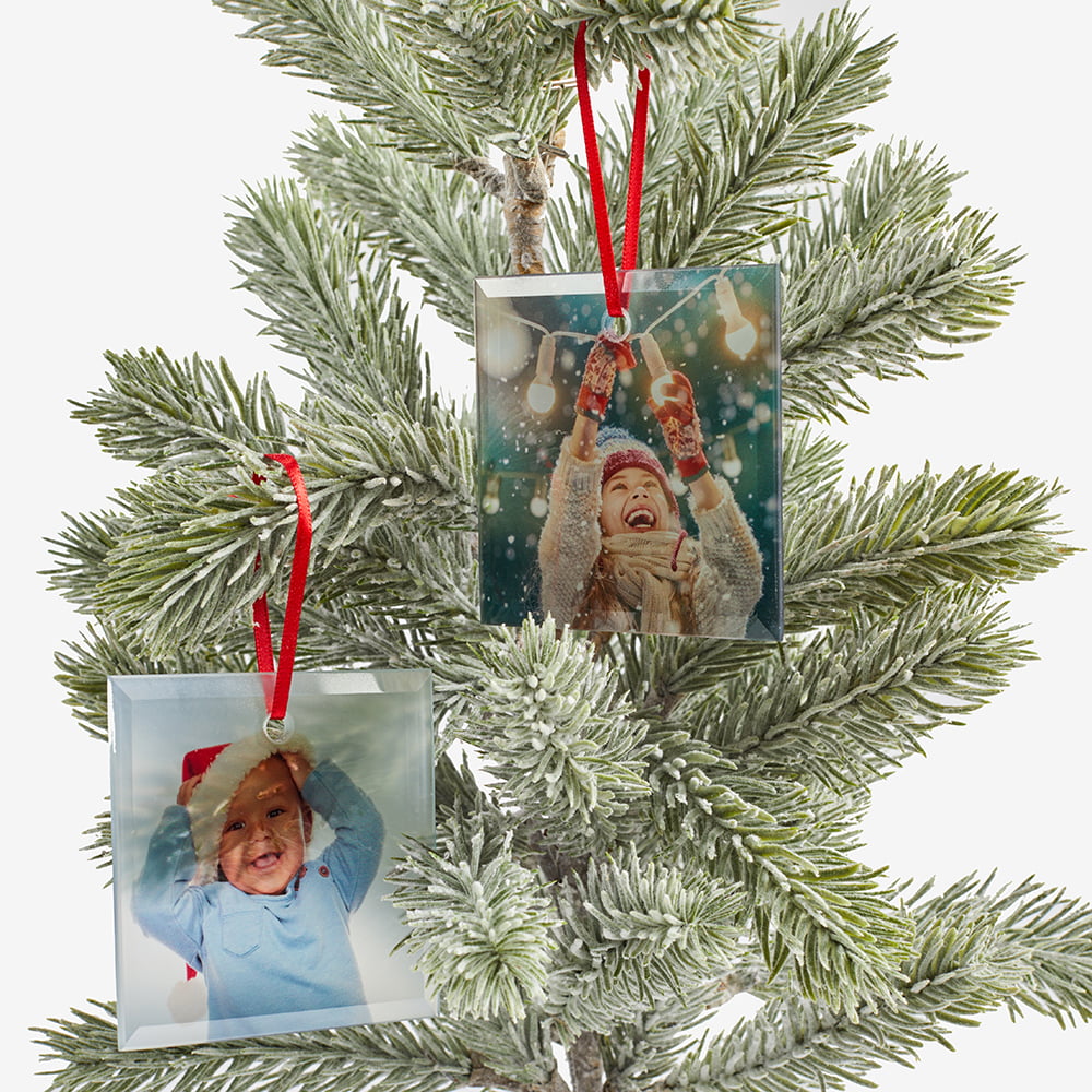 Glass christmas tree ornaments on tree